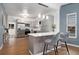 Contemporary kitchen with stainless steel appliances, sleek countertops, and bar seating at 3800 Umatilla St, Denver, CO 80211