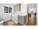 Bright laundry room equipped with modern appliances and ample counter space at 3800 Umatilla St, Denver, CO 80211