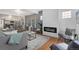 Modern living room with a sleek fireplace, neutral decor, and open floor plan at 3800 Umatilla St, Denver, CO 80211