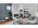 Stylish living room featuring a modern fireplace, comfortable seating, and ample natural light at 3800 Umatilla St, Denver, CO 80211