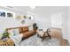 Bright living room featuring a cozy seating arrangement and natural light at 3800 Umatilla St, Denver, CO 80211
