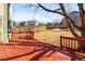 Large backyard with a red deck overlooking the large yard at 9632 Dolton Ct, Highlands Ranch, CO 80126