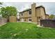 Large backyard featuring hot tub, shed, and grass for entertaining and relaxing at 13072 Westlake Pl, Broomfield, CO 80020