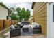 Backyard with a cozy outdoor seating area and hot tub near the house at 13072 Westlake Pl, Broomfield, CO 80020