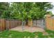 Fenced backyard featuring a separate dog run with secure gate and gravel at 13072 Westlake Pl, Broomfield, CO 80020