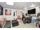 Finished basement room with comfortable seating, shelving, and ample space for recreation and relaxation at 13072 Westlake Pl, Broomfield, CO 80020