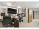 Versatile basement area with a television, desk, carpeting, and additional storage space at 13072 Westlake Pl, Broomfield, CO 80020