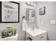 Charming bathroom features a white vanity with framed mirror and stylish decor at 13072 Westlake Pl, Broomfield, CO 80020