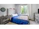 Inviting bedroom featuring a neutral color palette, plush carpet, and ample natural light from the window at 13072 Westlake Pl, Broomfield, CO 80020