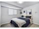Cozy bedroom features a comfortable bed with stylish decor, plus a sunny window at 13072 Westlake Pl, Broomfield, CO 80020