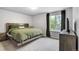 Serene bedroom with neutral gray walls, soft carpet, a window view, and modern furnishings at 13072 Westlake Pl, Broomfield, CO 80020