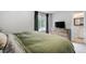 Comfortable bedroom features soft carpet, a window with natural light, and a connected bathroom at 13072 Westlake Pl, Broomfield, CO 80020