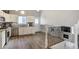 The modern kitchen features a door to the outside and an open staircase at 13072 Westlake Pl, Broomfield, CO 80020