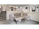 Spacious living room with stairs and view of the kitchen with breakfast bar at 13072 Westlake Pl, Broomfield, CO 80020
