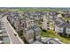 Community aerial showcasing the townhouse neighborhood layout and nearby greenery at 15843 E Broncos Pl, Englewood, CO 80112