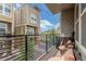 Relaxing balcony featuring comfortable seating, a grill, and neighborhood views at 15843 E Broncos Pl, Englewood, CO 80112