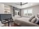 This bedroom features a large window, ceiling fan, and built-in shelving at 15843 E Broncos Pl, Englewood, CO 80112