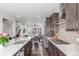 Modern kitchen with stainless steel appliances and stylish wood cabinetry at 15843 E Broncos Pl, Englewood, CO 80112
