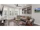 Comfortable living room with a ceiling fan and bright natural light at 15843 E Broncos Pl, Englewood, CO 80112