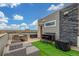 Rooftop patio area with outdoor seating, bar, and stunning views at 15843 E Broncos Pl, Englewood, CO 80112