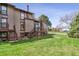 Townhome backyard with lawn, wood stairs and a deck, ideal for outdoor enjoyment at 4202 Greenbriar Blvd # 46, Boulder, CO 80305