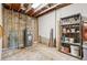 Unfinished basement area with utility access, storage shelving and natural light from skylight at 4202 Greenbriar Blvd # 46, Boulder, CO 80305