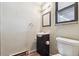 Small bathroom includes a pedestal sink, a standard toilet, and a classic mirror in a well-lit space at 4202 Greenbriar Blvd # 46, Boulder, CO 80305