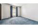 This bedroom features a large window, newer carpet, and neutral paint at 4202 Greenbriar Blvd # 46, Boulder, CO 80305