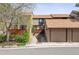 Cozy townhouse features a two-car garage with neutral color palette and mature landscape, creating a welcoming curb appeal at 4202 Greenbriar Blvd # 46, Boulder, CO 80305