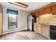 This is a cozy kitchen with wood cabinets, laminate countertops, and vinyl flooring at 4202 Greenbriar Blvd # 46, Boulder, CO 80305