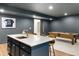 A basement bar with seating, countertops, and a pool table creates a perfect entertainment area at 5693 Missoula Trl, Castle Rock, CO 80108