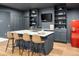 Finished basement bar area with seating, refrigerator, and shelving offers a relaxed entertainment space at 5693 Missoula Trl, Castle Rock, CO 80108