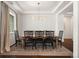 Dining room with wood floors, chandelier, six chairs, and a large window at 5693 Missoula Trl, Castle Rock, CO 80108