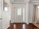 Bright foyer with hardwood flooring and an inviting front door at 5693 Missoula Trl, Castle Rock, CO 80108