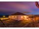 Charming single-story home with a well-lit patio, perfect for evening relaxation at 5693 Missoula Trl, Castle Rock, CO 80108