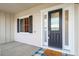 Home's front door featuring a black door with glass inserts and sidelights at 5693 Missoula Trl, Castle Rock, CO 80108