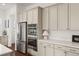 Modern kitchen boasts stainless steel appliances, abundant cabinetry, and sleek countertops for a functional and stylish cooking space at 5693 Missoula Trl, Castle Rock, CO 80108