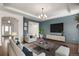 Open concept living room featuring bright accent wall and modern furniture at 5693 Missoula Trl, Castle Rock, CO 80108