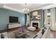 Inviting living room with fireplace, neutral colors, and modern decor, creating a cozy atmosphere for relaxing and entertaining at 5693 Missoula Trl, Castle Rock, CO 80108