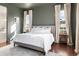 Cozy main bedroom with a comfortable bed, neutral decor, and plenty of natural light at 5693 Missoula Trl, Castle Rock, CO 80108