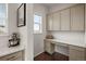 Functional home office space with built-in desk, storage cabinets, and a bright window offering a quiet and productive workspace at 5693 Missoula Trl, Castle Rock, CO 80108