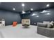 Basement playroom with soft seating, a hanging swing, and a slide provides endless fun at 5693 Missoula Trl, Castle Rock, CO 80108