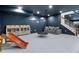 Spacious basement playroom with cozy seating and a fun swing, perfect for Gathering enjoyment at 5693 Missoula Trl, Castle Rock, CO 80108