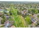 Aerial view of home nestled in lush community with walking trail at 7583 S Xanthia Ct, Centennial, CO 80112