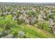 Aerial view of home nestled in lush community with walking trail at 7583 S Xanthia Ct, Centennial, CO 80112