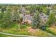 Aerial view of home with a large, fenced backyard and mature trees at 7583 S Xanthia Ct, Centennial, CO 80112