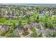 Aerial view of home nestled in lush community near trails, tennis court and pool at 7583 S Xanthia Ct, Centennial, CO 80112