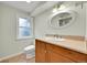 Bathroom featuring a window for natural light and vanity with storage at 7583 S Xanthia Ct, Centennial, CO 80112