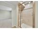 Bathroom with a tile shower, built-in seat, glass doors and mosaic tile accents at 7583 S Xanthia Ct, Centennial, CO 80112