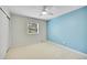 Bright bedroom featuring a large window, neutral carpet and ceiling fan at 7583 S Xanthia Ct, Centennial, CO 80112